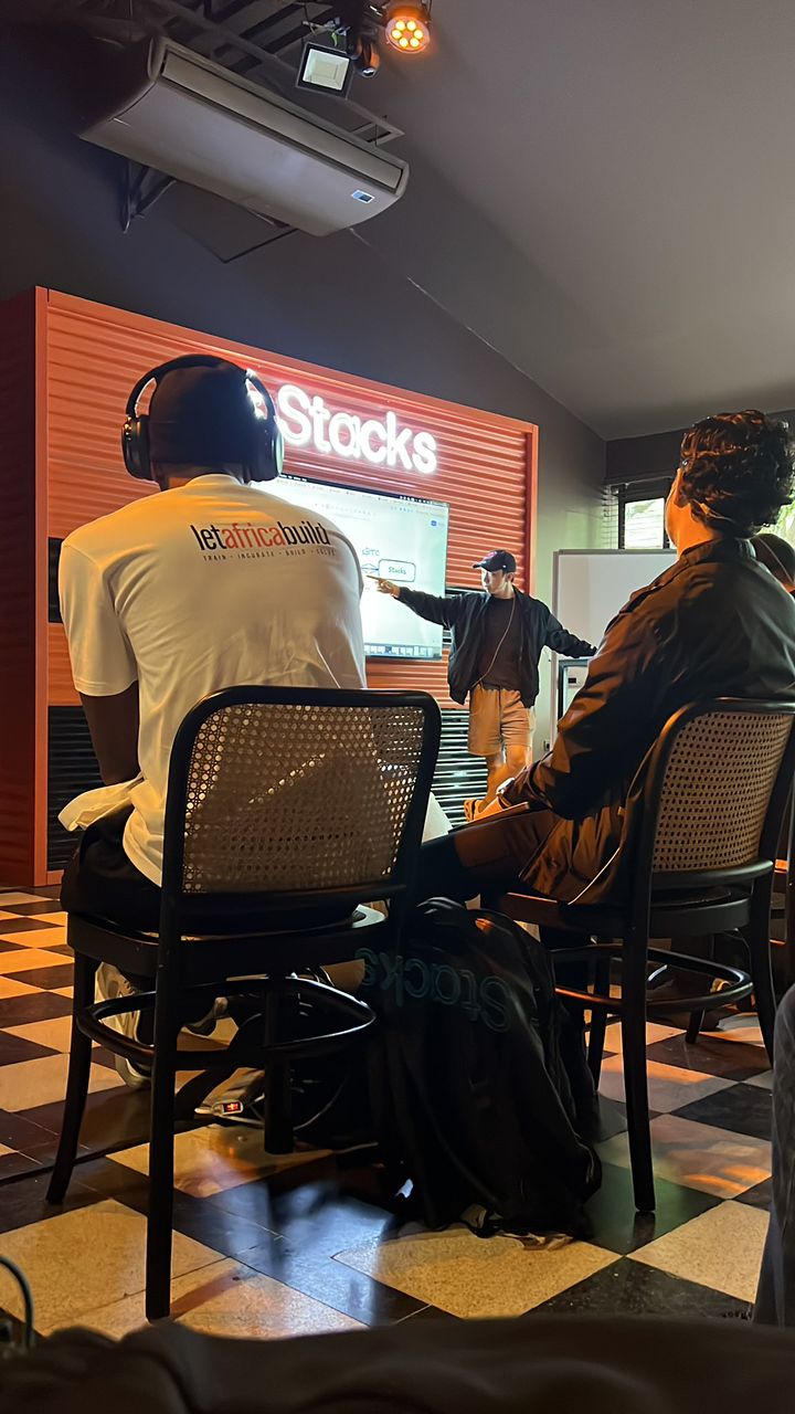 Developers at a Let Africa Build session in Lagos, working at laptops around a shared table